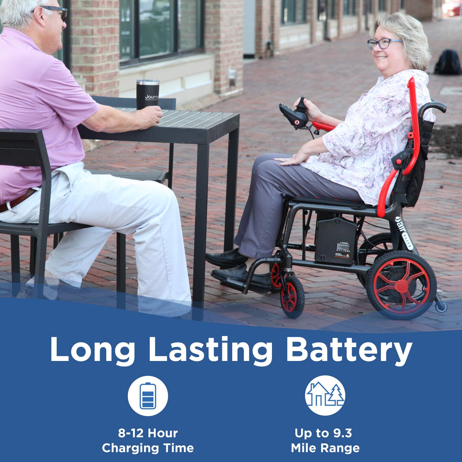 A woman in a red Journey Certified Pre-Owned Air Elite Lightweight Power Chair smiles at a man outdoors. Text reads, “Long Lasting Battery,” with icons for 8–12 hour charge time and up to 9.3 mile range.