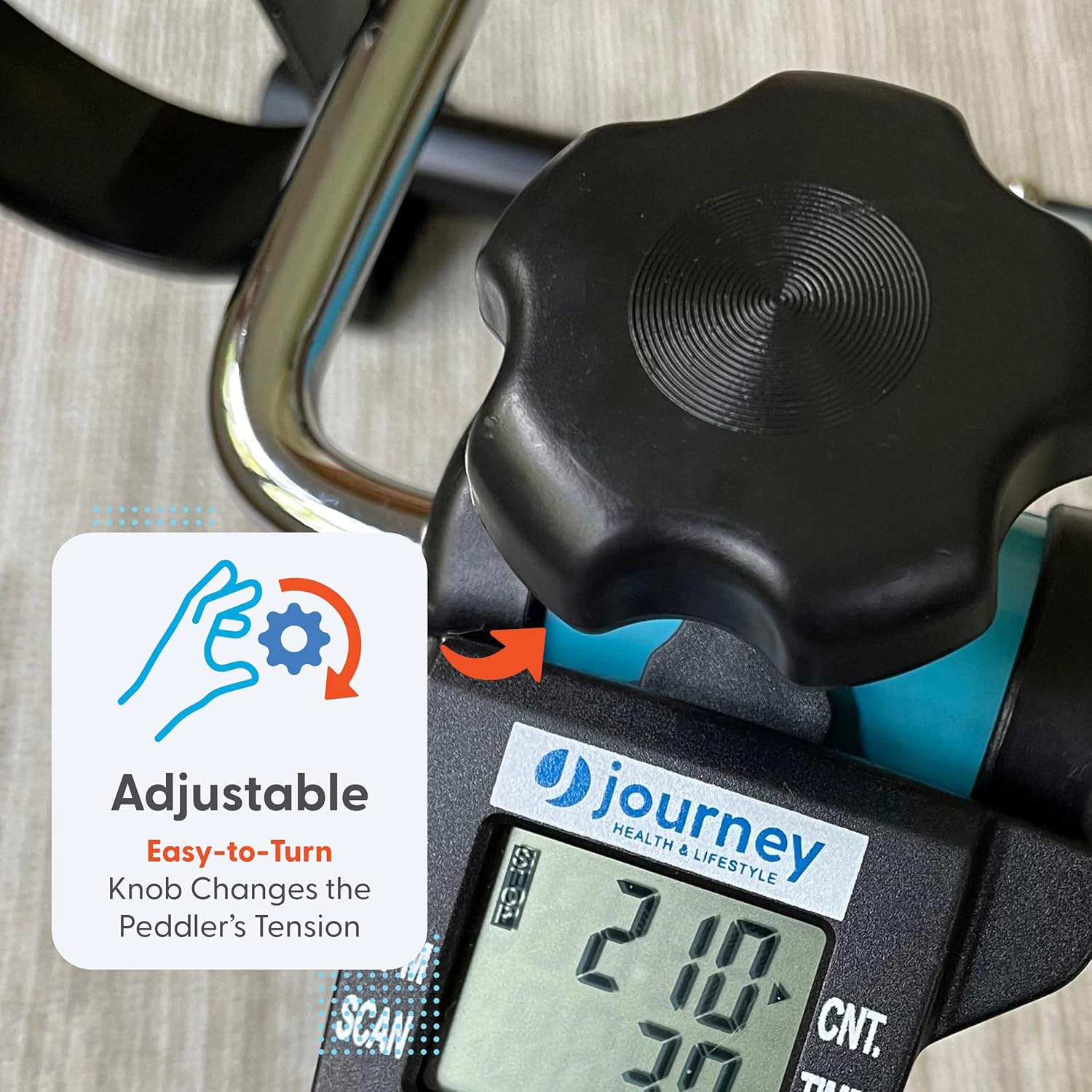 Close-up of the Journey Exercise Peddler’s easy-to-turn tension knob above a digital display, with an orange arrow and hand graphic. Text: Adjustable knob lets you change the Journey Portable Pedal Exerciser’s resistance.