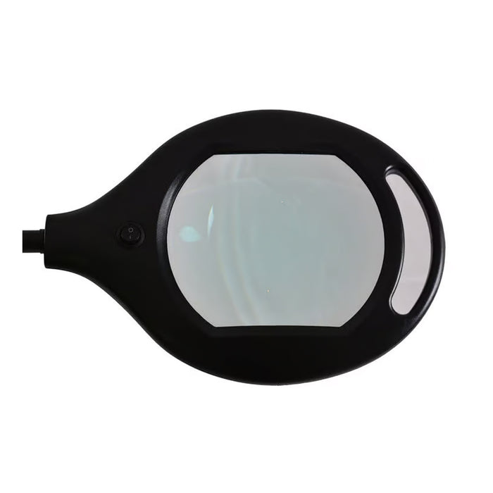 The 5X Glass Floor Stand Magnifier With Light features a rectangular lens, black handle and frame, 5X magnification, a small round button, and an oval grip opening on one side.