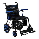 The Journey Air Elite Lightweight Folding Power Chair features a black carbon fiber frame, blue accents, padded seat, joystick armrest control, footrest, and front/rear wheels. Journey appears on the seat and footrest.