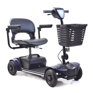 The Journey Adventure Scooter is a four-wheeled mobility scooter for seniors, featuring a black cushioned seat, armrests, handlebar controls, and a front basket to assist those with limited mobility.