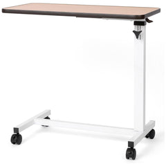 The Journey Overbed Table – Adjustable & Portable Design features a rectangular wood surface with an easy-to-clean tabletop, supported by a sturdy white metal frame and four black wheels for smooth mobility. Designed as a rolling bedside table, it is ideal for use beside a bed or chair.