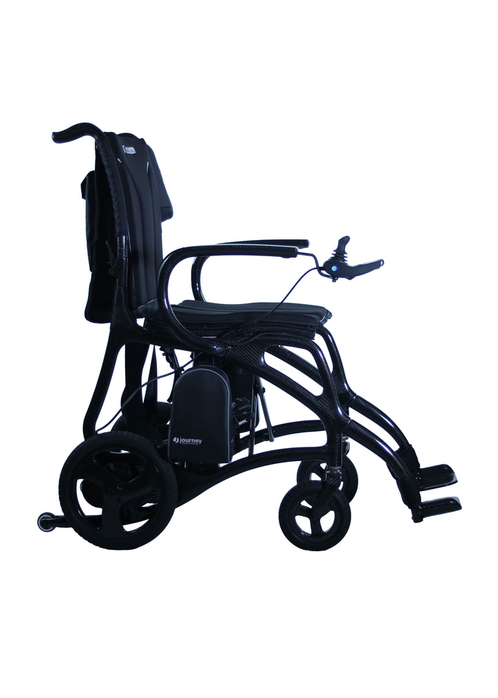 The Journey Air Elite Max is a black carbon fiber wheelchair with armrests, padded seat, right-arm joystick control, large rear wheels, and small front wheels, displayed from the side on a white background.