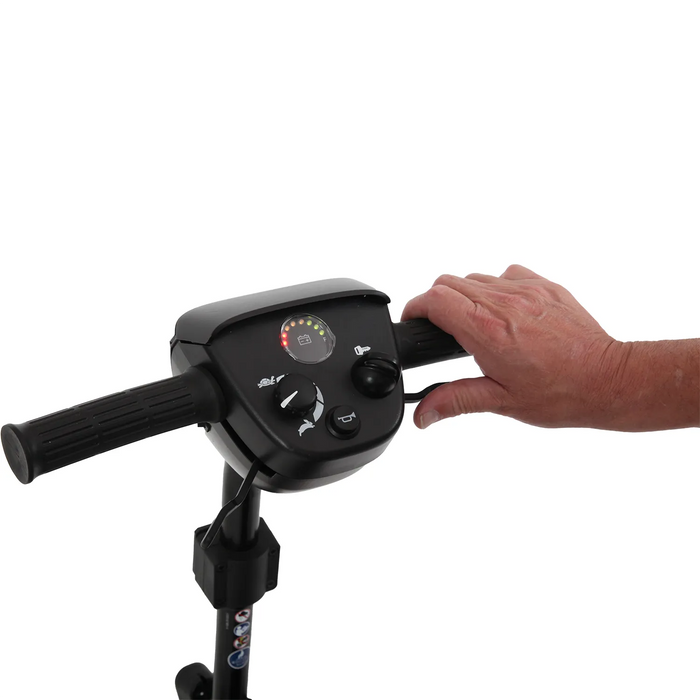 A hand rests on the right handlebar of the Journey Adventure Scooter, displaying its control panel with speed and battery indicators against a white background.