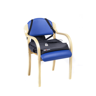 A wooden chair with blue cushions features the SitNStand Lift Assist Compact for Travel on the seat, turning it into a portable lift chair that helps users stand up more easily.