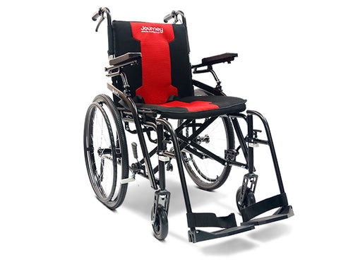 A black Open Box So Lite® Super Lightweight Folding Wheelchair with red seat and back padding, labeled Journey at the top. Features include large rear wheels, small front wheels, armrests, and footrests.