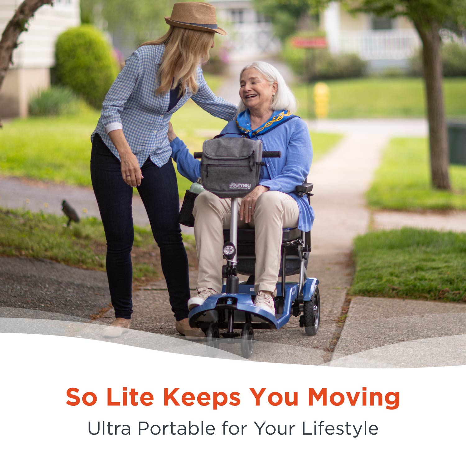 A smiling older woman sits in a motorized wheelchair on the sidewalk, beside a happy younger woman in a hat. Text below reads, “Journey So Lite Folding Power Scooter—Ultra Portable for Your Lifestyle.”.