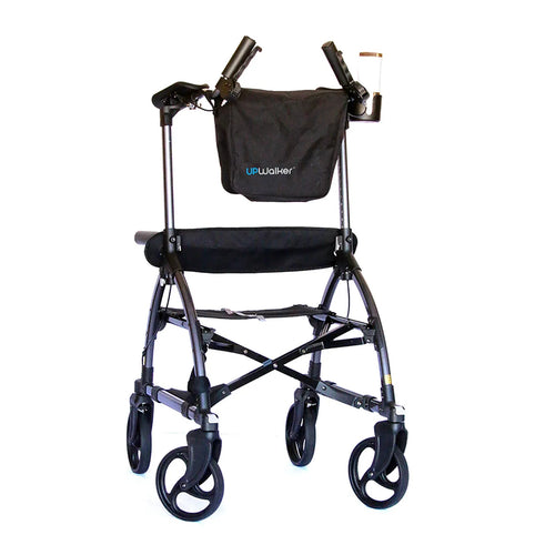 The UPWalker® Original is a black upright rollator with four wheels, ergonomic handles, a seat, and a storage pouch, designed to help users walk more comfortably and improve stability.