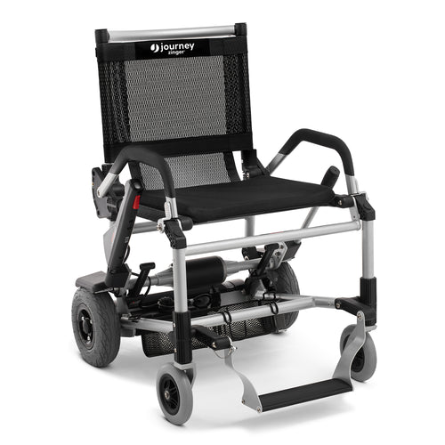 The Zinger® Folding Power Chair features a black seat, mesh backrest with Journey branding, sturdy silver frame, large rear wheels, small front wheels, armrests, and a footrest. Certified pre-owned.