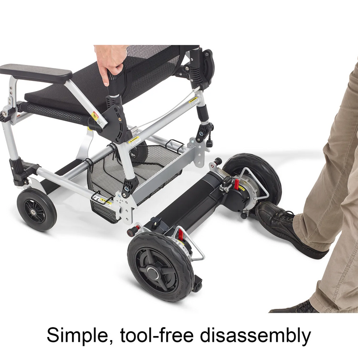 A person easily disassembles the Journey Zoomer Lightweight Folding Power Chair by separating the seat from the wheels without tools. Text reads: Simple, tool-free disassembly.