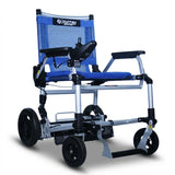 The Journey Zoomer Lightweight Folding Power Chair features a blue and silver frame, black armrests, joystick controls, mesh backrest, and large rear wheels for easy mobility.