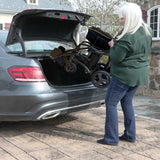 Image of woman lifting the Air Elite Max into the trunk of her car demonstrating the lightweight Carbon fiber frame weighs only 24.25 lbs.
