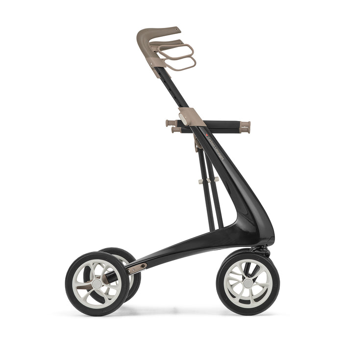 Side view of the byACRE Carbon Ultralight Rollator, a modern black carbon fiber mobility aid with large wheels and a beige ergonomic handlebar for easy movement.