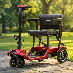 A Red Journey So LIte Scooter parked on a path in a park
