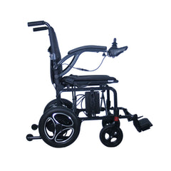 Side view of the Journey Air 2026 portable folding electric power chair showing its compact frame, armrests, footrest, and lightweight folding design for travel and storage.