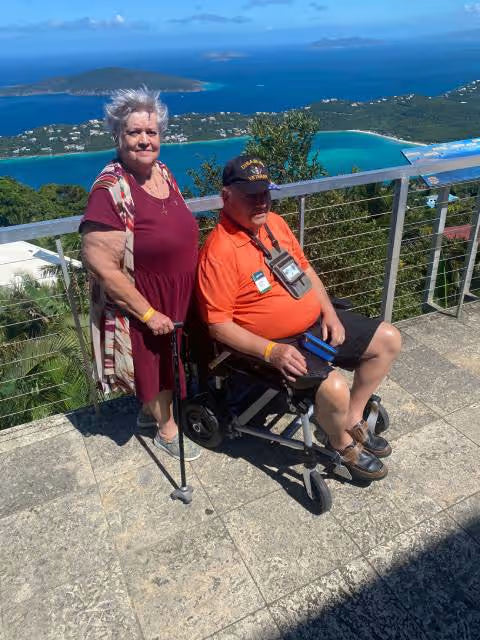 Journey Health customer using portable power wheelchair outdoors