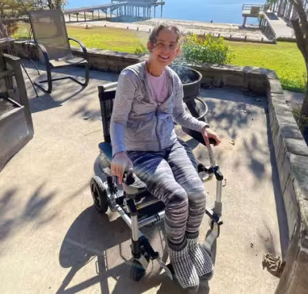Journey Health customer riding mobility scooter outdoors