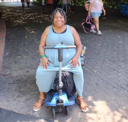 Journey Health customer using blue mobility scooter