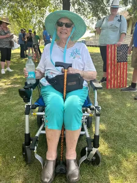 Journey Health customer using lightweight power wheelchair outdoors