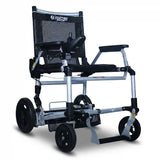 Journey Zoomer lightweight folding power chair in black featuring a silver frame, black mesh seat, armrests, footrests, right-arm joystick control, and four black wheels designed for compact folding and portable mobility.