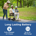 Older man using a Journey Zoomer lightweight folding power chair on a park path with a smiling woman and child on a scooter, highlighting long-lasting battery performance with up to 9+ mile range and 4-hour charging time.