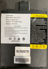 Close-up of a Journey So Lite Scooter Replacement 10Ah Lithium Battery label, 25.9V (269.7Wh), IEC 62133 compliant, with safety warnings, “Made in China,” and yellow icons—ideal as a mobility scooter battery replacement.