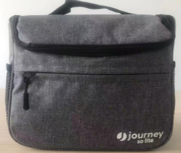 The Journey So Lite Power Scooter Front Bag Replacement features gray fabric, a front zipper pocket, black top handle, and the journey so lite logo in white—ideal as a mobility scooter or replacement front bag.