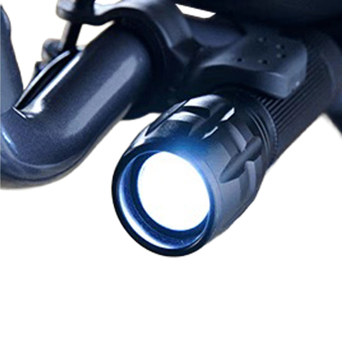 Close-up of the Journey UPWalker Flashlight – Easy Install, a hands-free light mounted on a black bicycle handlebar, illuminating the path ahead for improved safety and visibility.