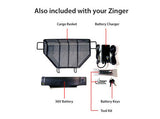 Image displays the items included with a Journey Zinger® Folding Power Chair: mesh cargo basket, 36V battery, charger, battery keys, and tool kit—all labeled and neatly arranged on a white background.