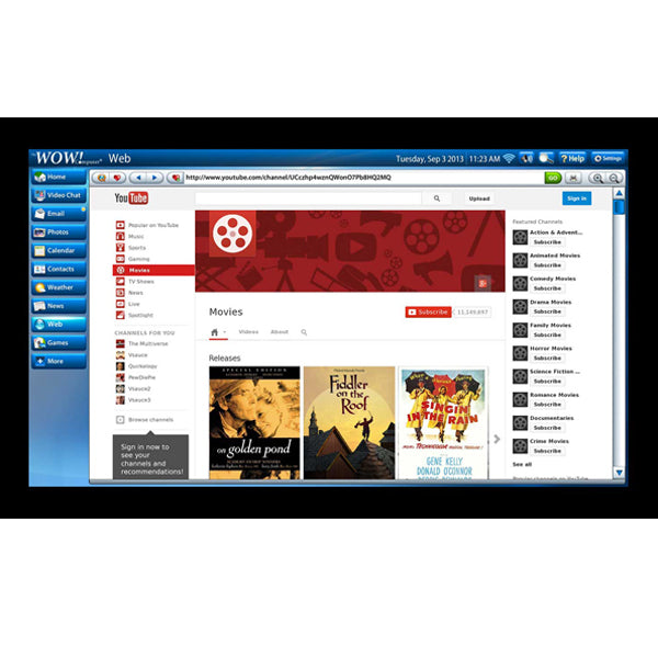 The WOW! computer by telikin displays a web browser open to YouTube Movies, featuring a blue sidebar and easy navigation, highlighting how simple it is for seniors to browse movie releases.